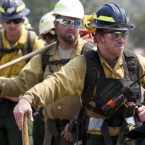 Firefighter Craig Ogden of the Red Rock Interagency Crew looks on before going to fight the fire on 19 June, 2011. (AP Photo/ The Arizona Republic, David Wallace)