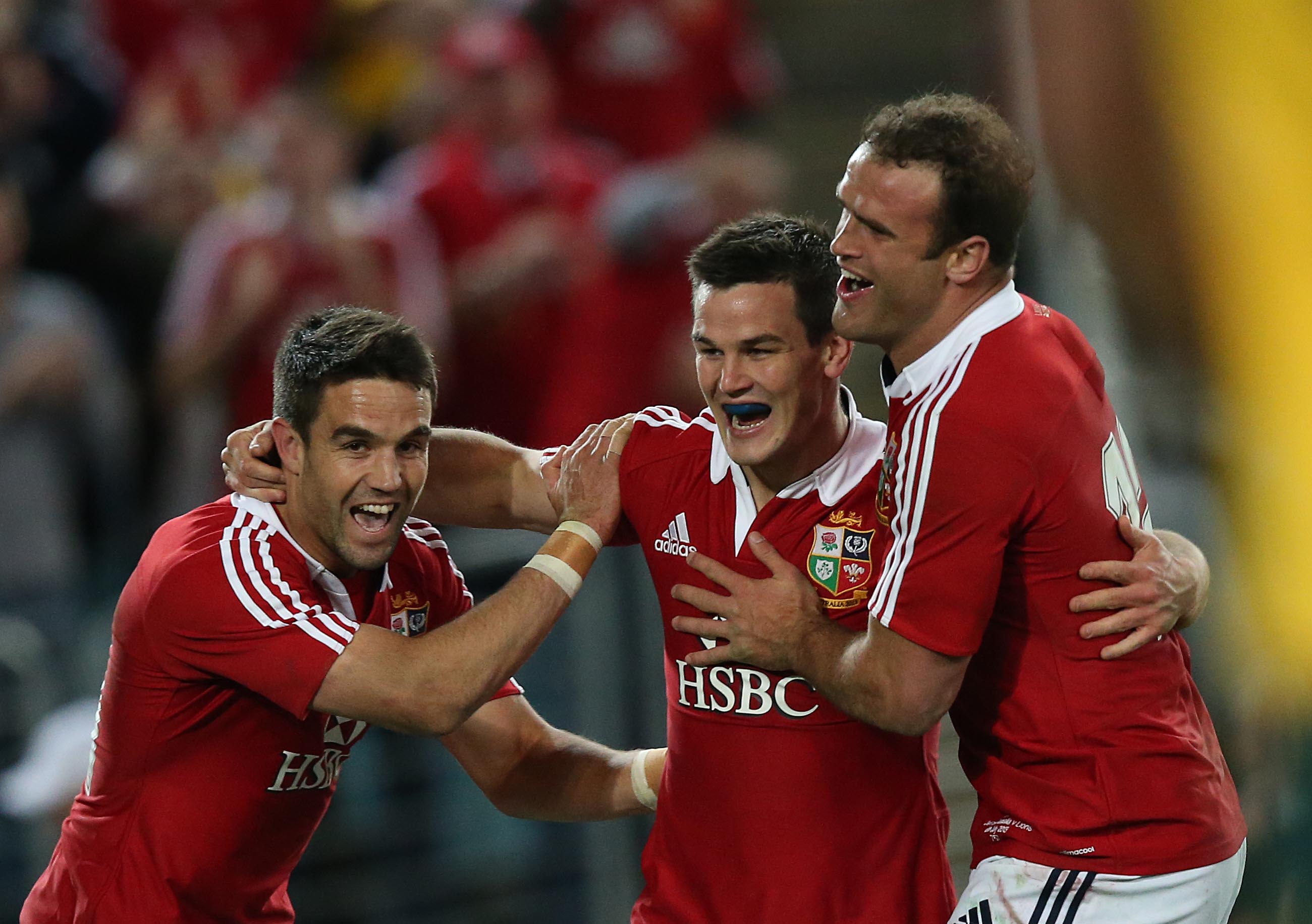 British and Irish Lions's  Conor Murray Jonathan Sexton and Jamie Roberts celebrate after Jonathan Sexton scores