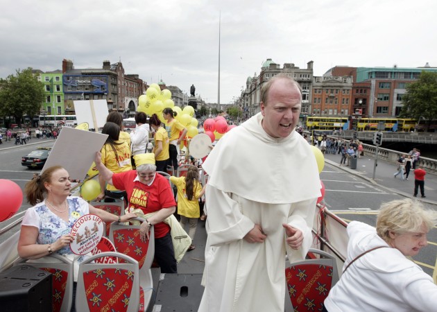 Picture from the pro-life demonstration. Picture is taken of the top of an open-topped bus, focusing on an angry-looking priest.