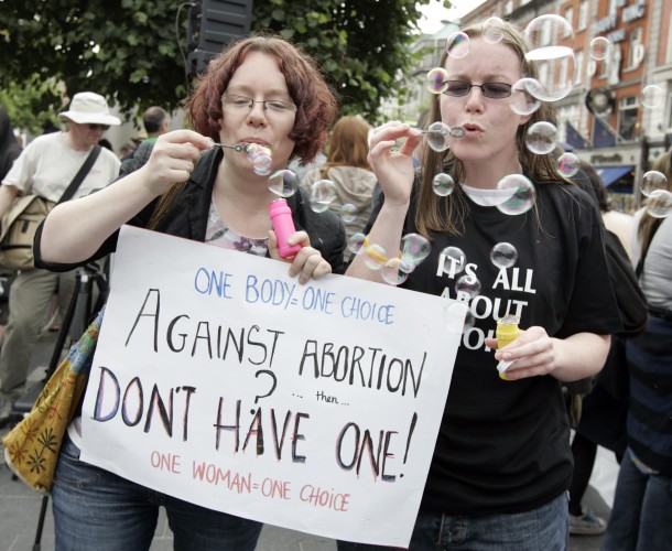 Me and another demonstrator at the pro-choice demo. We're both blowing bubbles. I'm holding a sign saying "One body, one choice. Against abortion? Don't have one!"